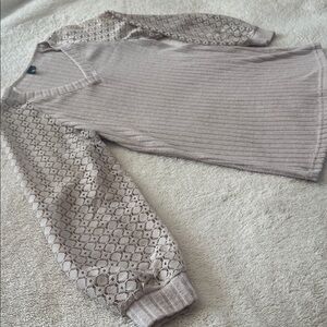 Light beige ribbed knit top with stylish lacey sleeves.